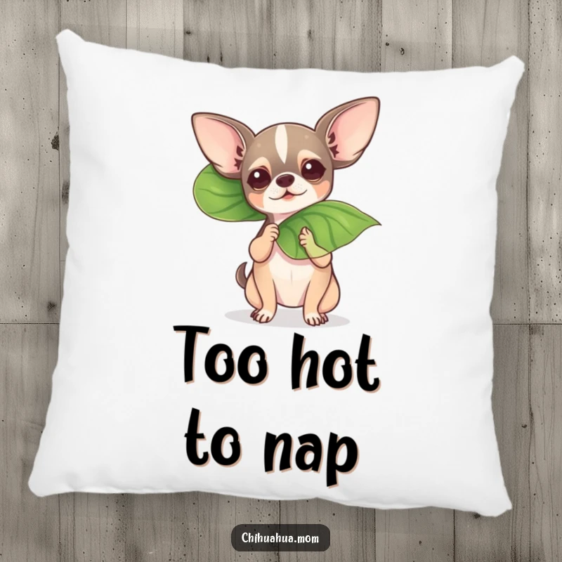 Funny chihuahua fanning itself with a leaf on a soft and humorous pillow.