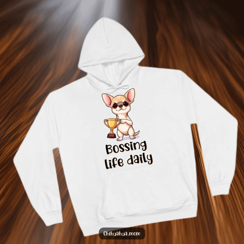 Funny Hoodie: a determined chihuahua heroically holding a tiny trophy, radiating confidence and a victorious, humorous spirit.