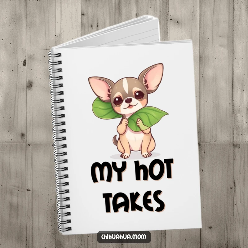 Funny chihuahua fanning itself with a leaf on a notebook, ideal for jotting down dramatic thoughts.