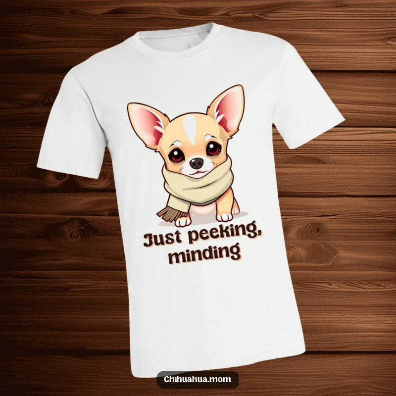 Funny T-Shirt: a chihuahua sporting a silly scarf peeks out playfully, capturing a moment of adorable, humorous mischief.